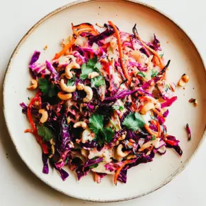 Roasted Cabbage with Ginger Lime Root Slaw Cashews
